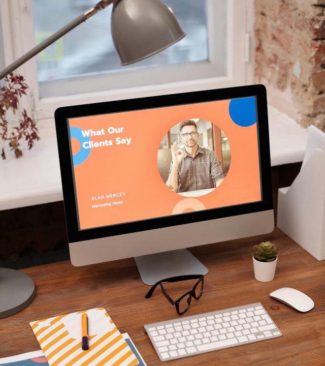 Stylish home office setup with computer showcasing client testimonials.